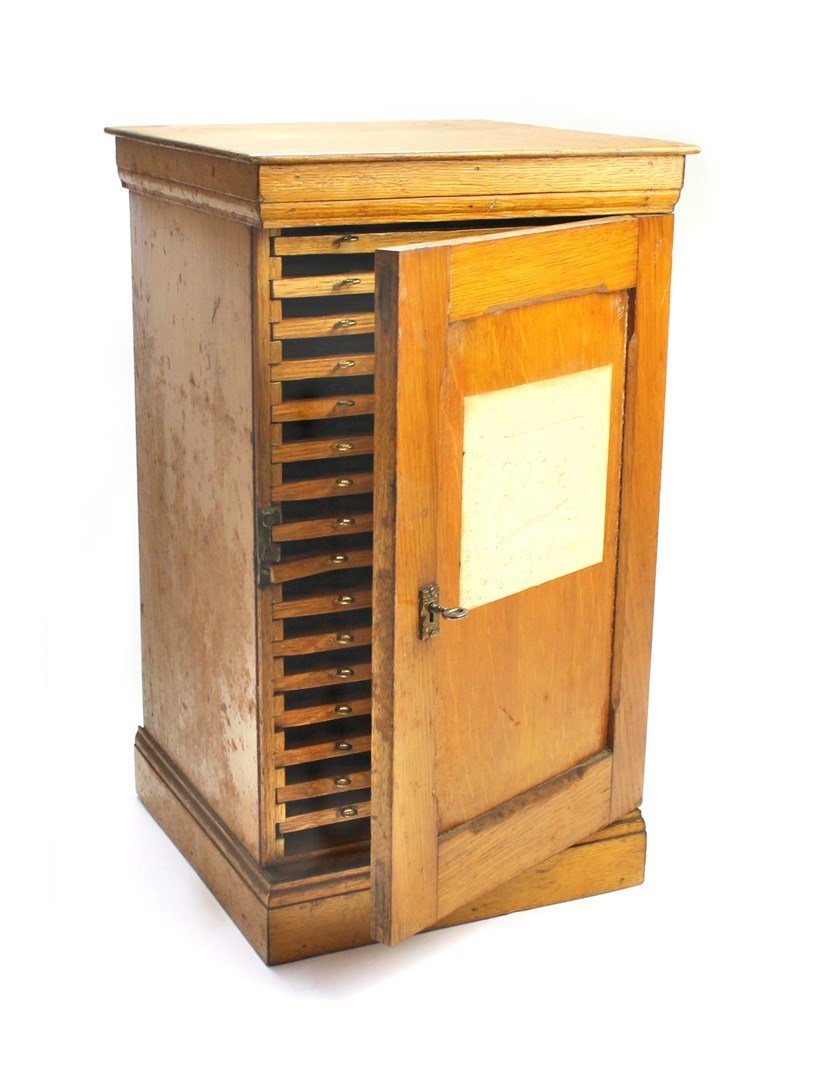 Appraisal: An oak table top collector's cabinet circa the single panel