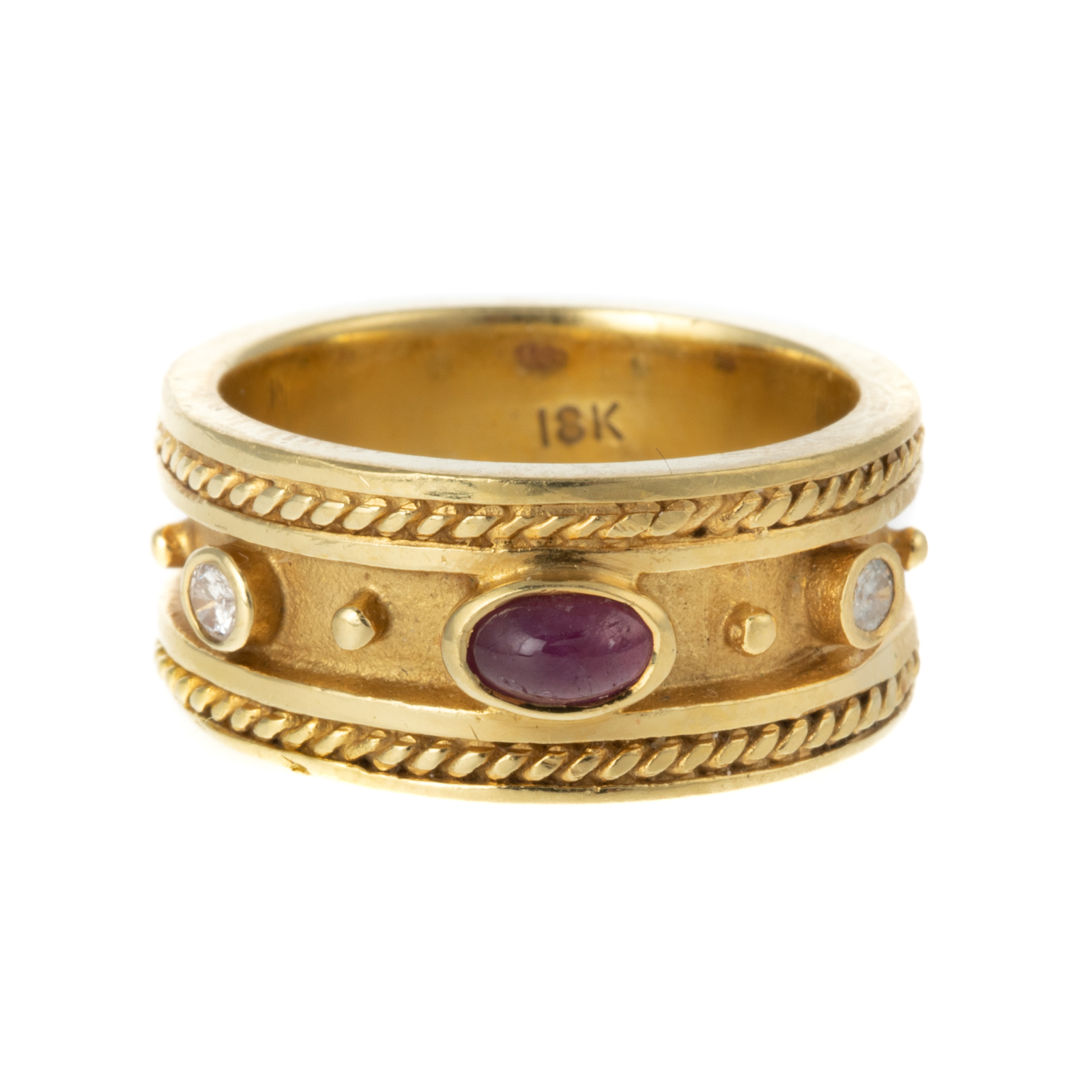 Appraisal: A BEZEL-SET RUBY DIAMOND BAND IN K K yellow gold