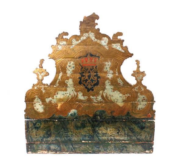 Appraisal: An Italian Rococo painted and parcel giltwood headboard composed of