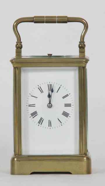 Appraisal: A gilt brass cased carriage clock the white enamel dial