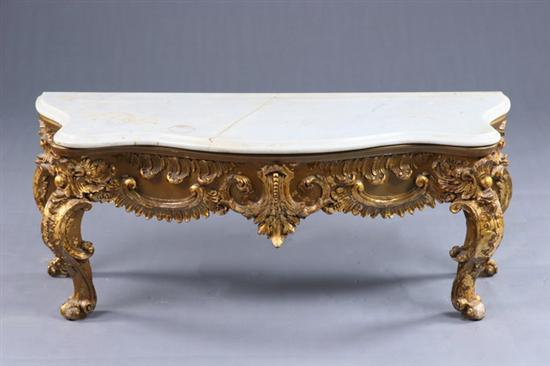 Appraisal: LOUIS XV STYLE LOW CONSOLE TABLE th century gilt-wood Molded-edge