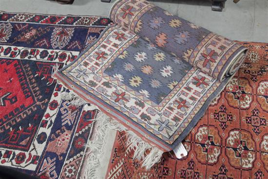 Appraisal: THREE ORIENTAL AREA RUGS Ivory and dark blue with multiple