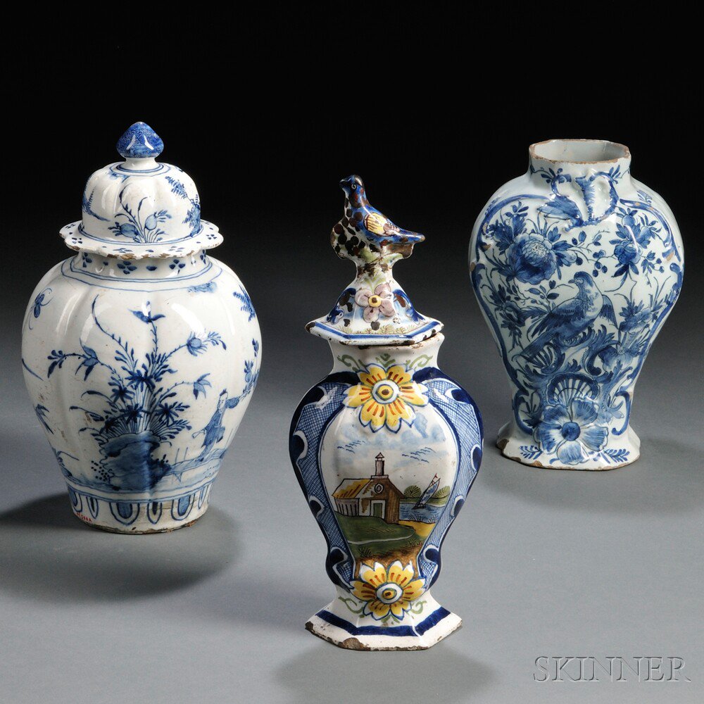 Appraisal: Three Dutch Delft Vases Holland th century two with covers