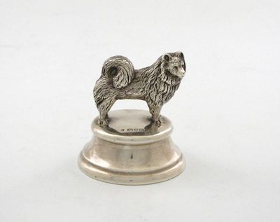 Appraisal: An Edwardian silver novelty dog paper-weight the standing Samoyed dog