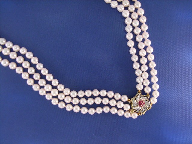 Appraisal: A mm triple strand Akoya pearl necklace with a ct