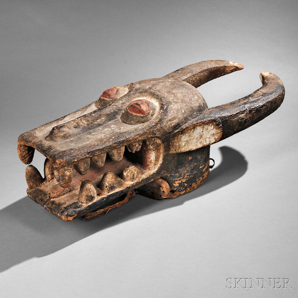 Appraisal: Large Baule Bush-Cow Helmet Mask with prominent teeth and backswept