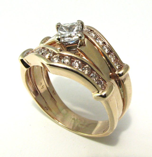 Appraisal: DIAMOND AND FOURTEEN KARAT GOLD RING centering a princess-cut diamond