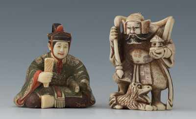 Appraisal: Two Carved Ivory Okimonos Containig a seated official wearing elaborate