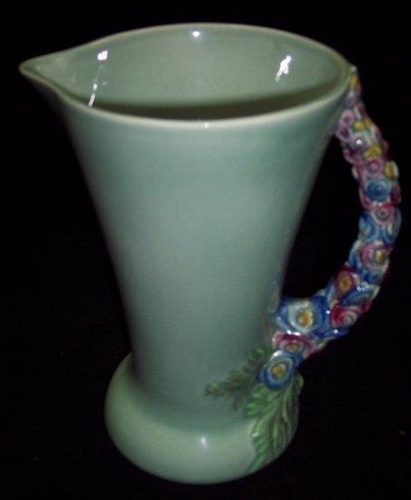 Appraisal: A Clarice Cliff green glaze jug of tapering form the