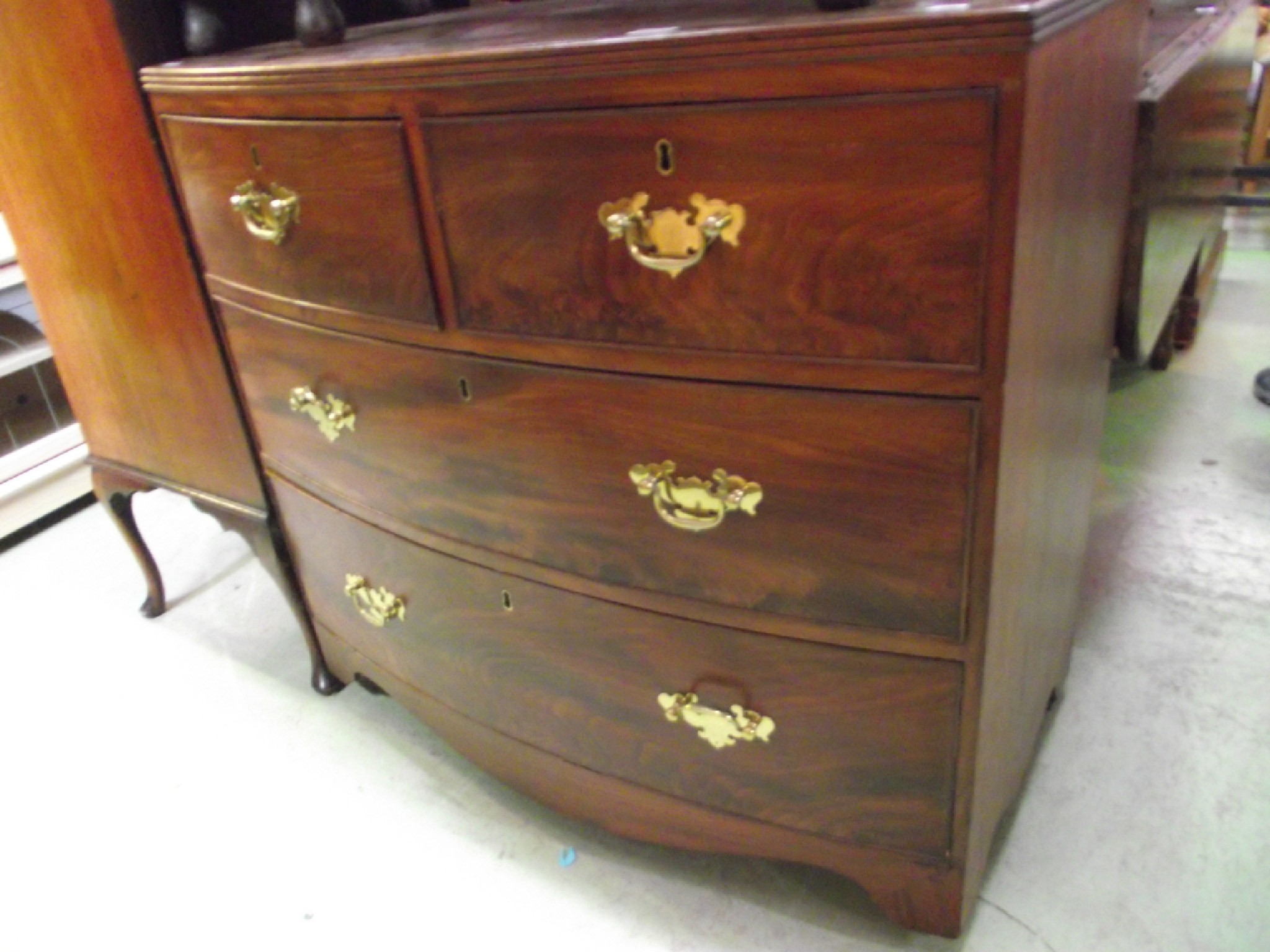 Appraisal: A small Regency mahogany bow fronted bedroom chest of two