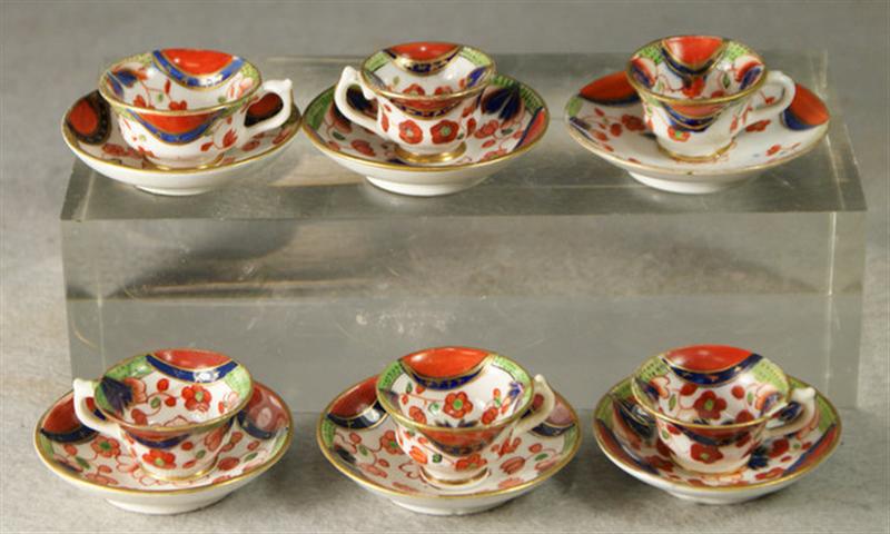 Appraisal: Imari palette English soft paste miniature cups and saucers saucer