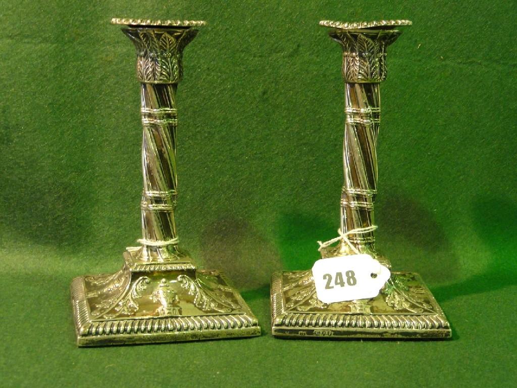 Appraisal: A pair of silver candlesticks with twisted stems square cut