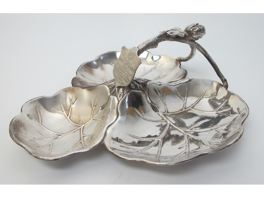 Appraisal: A Victorian silver strawberry dish of trefoil leaf form with