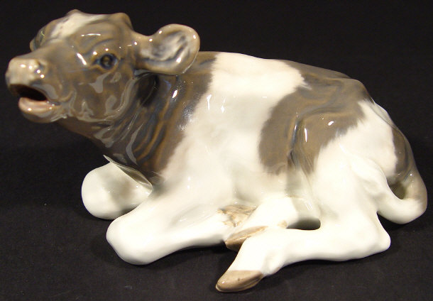 Appraisal: Royal Copenhagen porcelain cow with hand painted decoration printed factory