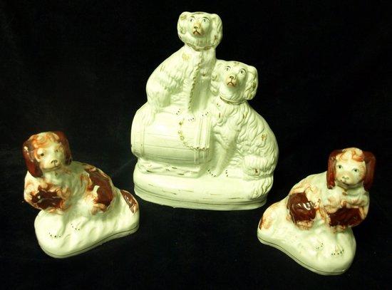 Appraisal: A Staffordshire figure of two dogs one seated on a