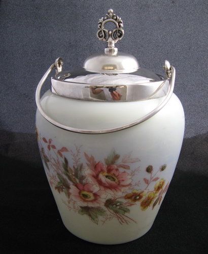 Appraisal: A MERIDEN SILVER AND DECORATED GLASS BISCUIT BARREL in the