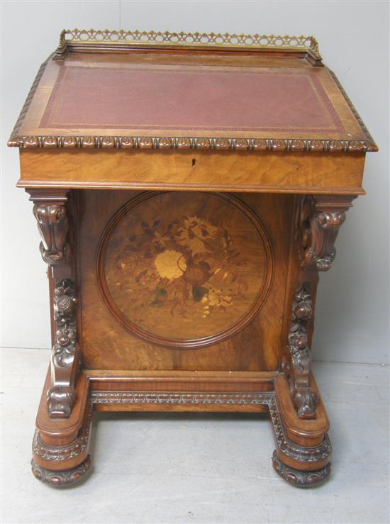 Appraisal: th century walnut and parquetry inlaid davenport with a raised