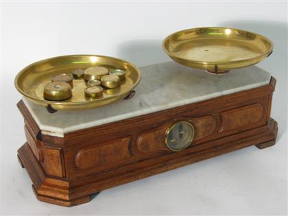 Appraisal: Vicorian walnut and iron food scale with twin brass pans