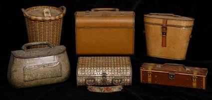 Appraisal: SIX CHROMOLITHOGRAPHED TIN BISCUIT BOXES In the form of suitcases