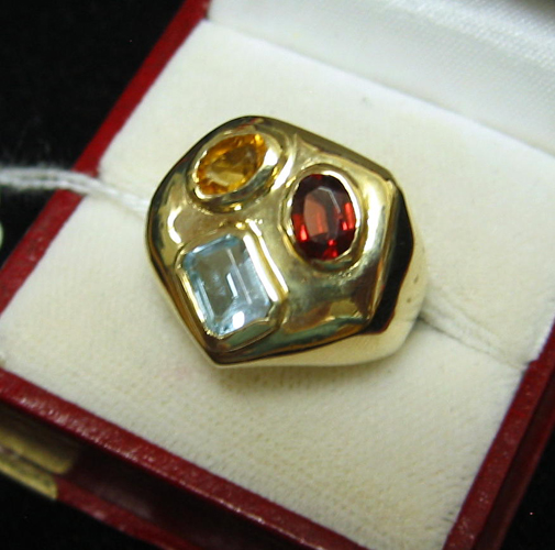 Appraisal: GARNET CITRINE TOPAZ AND FOURTEEN KARAT GOLD RING Set with