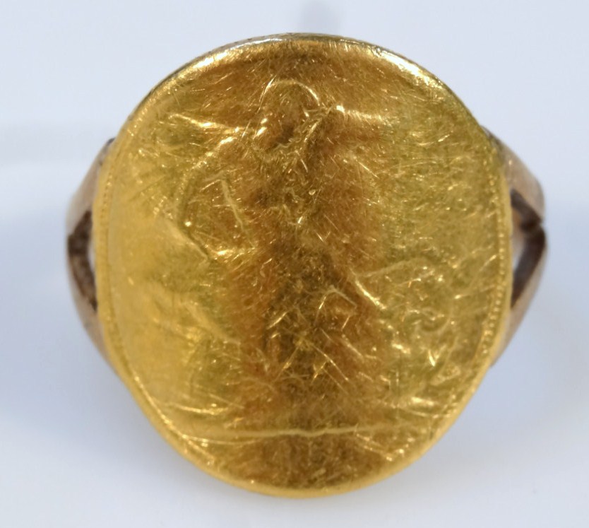 Appraisal: A gold sovereign curved ring on a part pierced shank