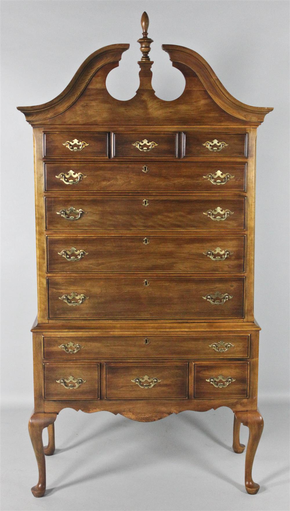 Appraisal: AMERICAN QUEEN ANNE STYLE CHERRYWOOD HIGHBOY the scroll-carved cresting centering