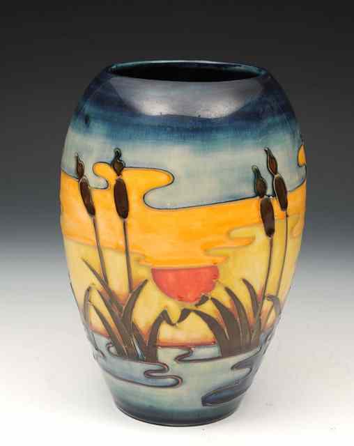 Appraisal: A Moorcroft 'Reeds at Sunset' baluster vase designed by Philip