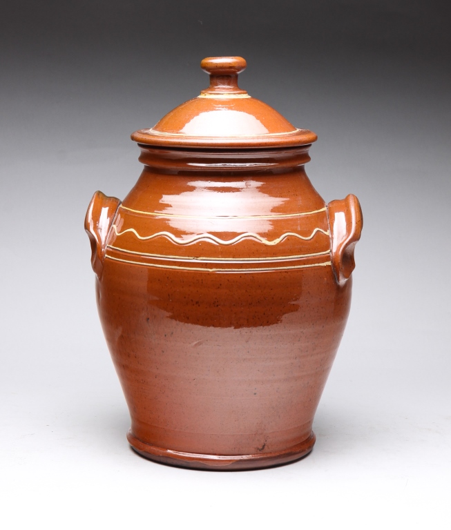 Appraisal: CONTEMPORARY TURTLE CREEK LIDDED JAR Ohio Slip decoration with applied