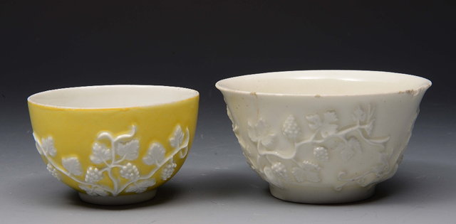 Appraisal: A MEISSEN YELLOW GROUND TEA BOWL decorated with trailing white