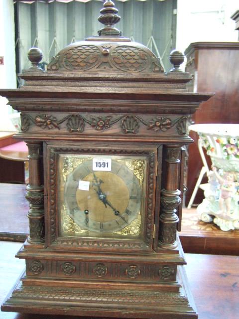 Appraisal: A German oak cased mantel clock with architectural case and