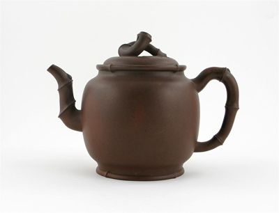 Appraisal: A Chinese Yixing teapot and cover the handle spout and