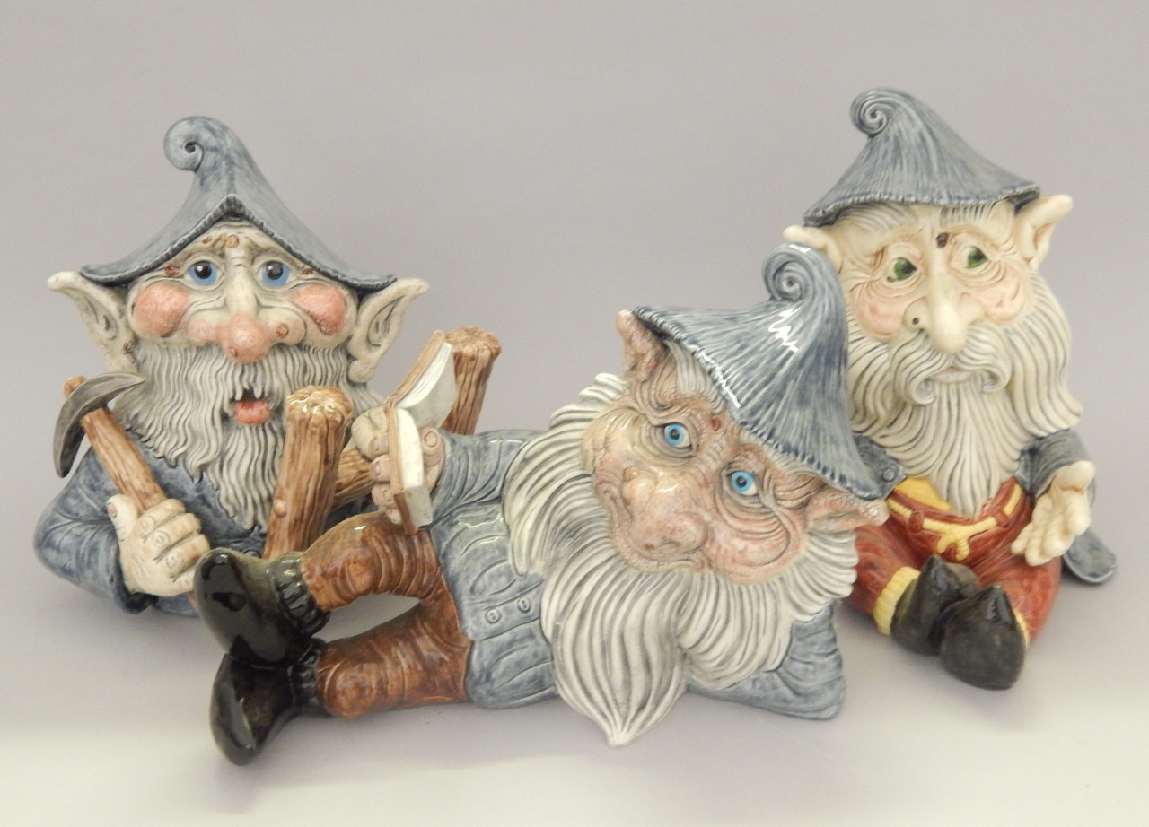 Appraisal: Three Studio Pottery garden gnomes to include reclining and climbing