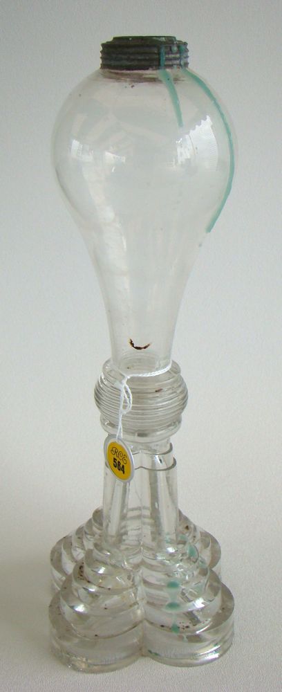 Appraisal: CLEAR GLASS WHALE OIL LAMP th CenturyWith pressed quatrefoil base