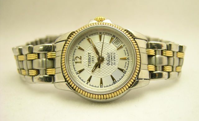 Appraisal: Lady's Tissot Two-Tone Stainless Watch T-Round Sapphire Crystal T