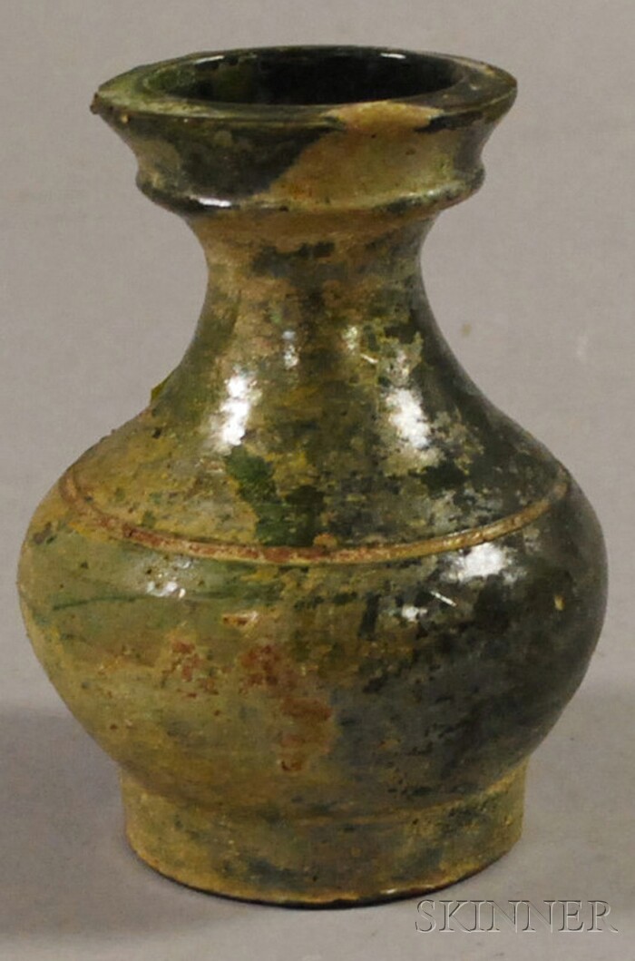 Appraisal: Green Glazed Jar China Han-style the pottery jar covered with