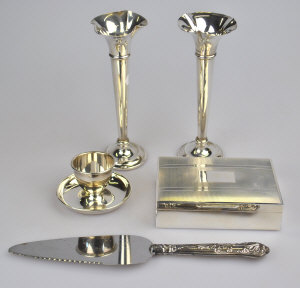 Appraisal: A silver cigarette box egg cup pair of specimen vase