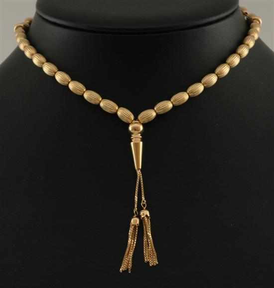 Appraisal: A strand of gold worry beads Comprising a series of