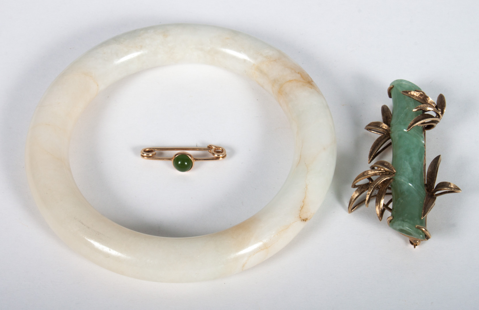 Appraisal: Three jade jewelry items jade bangle bracelet jade and K