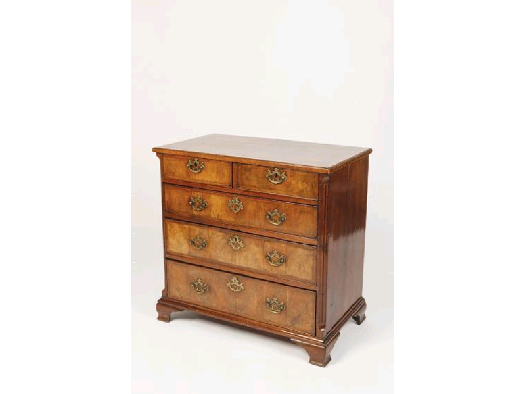 Appraisal: A GEORGE II WALNUT CHEST OF DRAWERS with a quarter