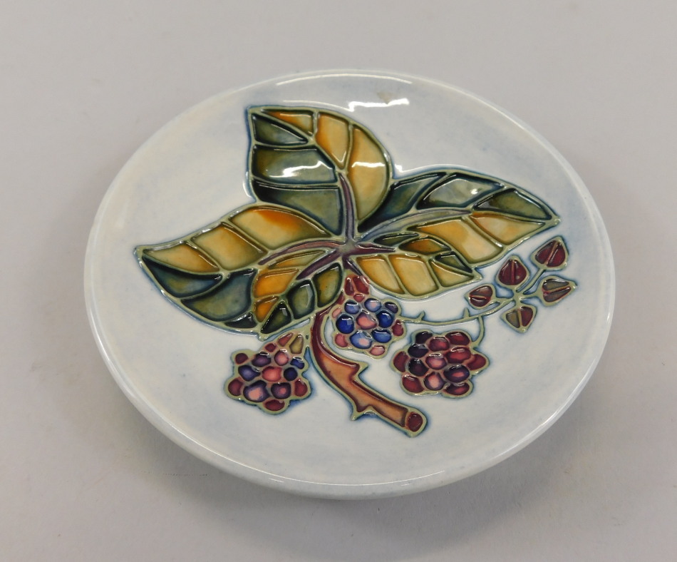 Appraisal: A Moorcroft pin dish decorated with Autumn leaves and berries