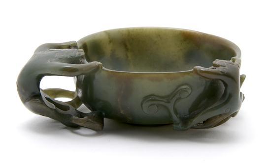 Appraisal: Spinach Jade Handled Cup having carved animal decoration with the