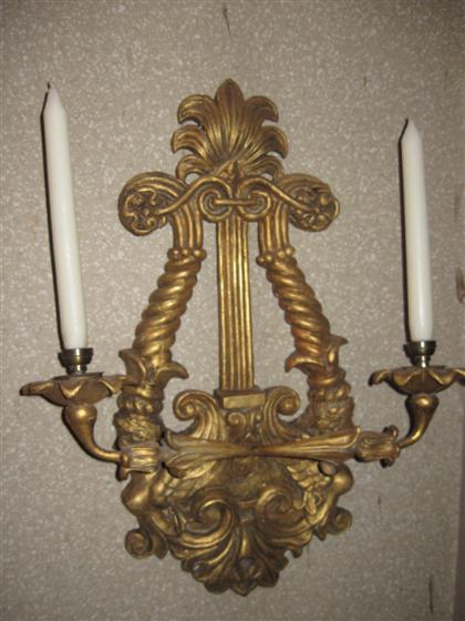 Appraisal: Continental carved giltwood lyre-form two light wall light th century