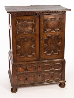 Appraisal: An th Century oak cupboard the two panelled doors enclosing