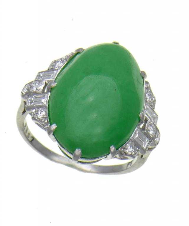 Appraisal: A FINE JADE AND DIAMOND RING the cabochon between shoulders