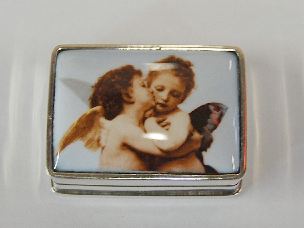 Appraisal: Rectangular white metal hinged pill box having porcelain plaque featuring