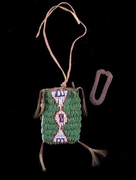 Appraisal: Comanche Strike-A-Lite Iron Beaded Bag c The lot features a