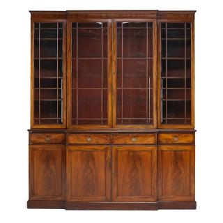 Appraisal: GEORGE III MAHOGANY BREAKFRONT BOOKCASE Four glazed panel doors above