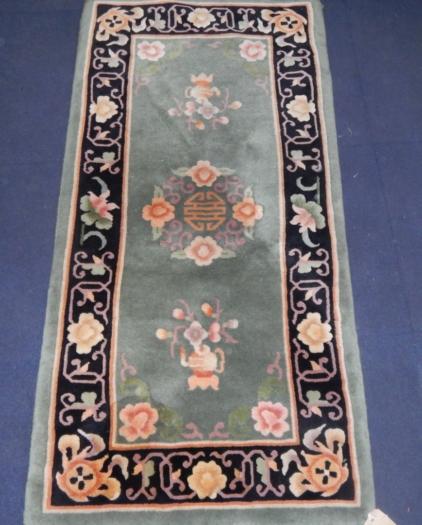 Appraisal: A Chinese floral green ground rug cm x cm circular