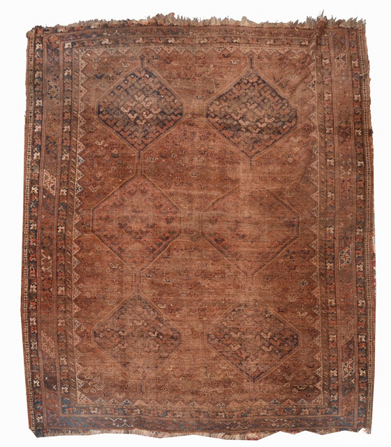 Appraisal: AN ANTIQUE SHIRAZ CARPET with two rows of interlocking medallions