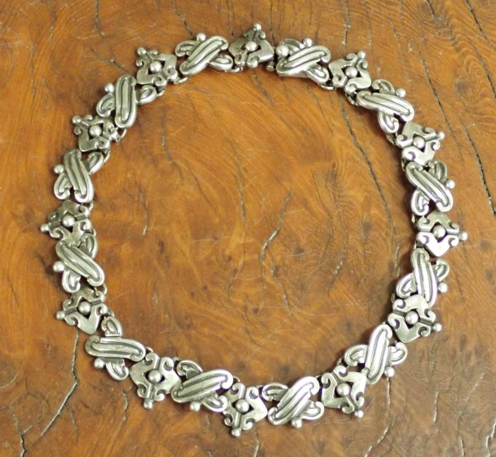 Appraisal: TAXCO STERLING CHOKER NECKLACE having twenty-four alternating symbols with a